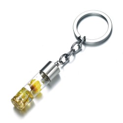 Porte-clés créatif flacon avec fleur jaune sèche